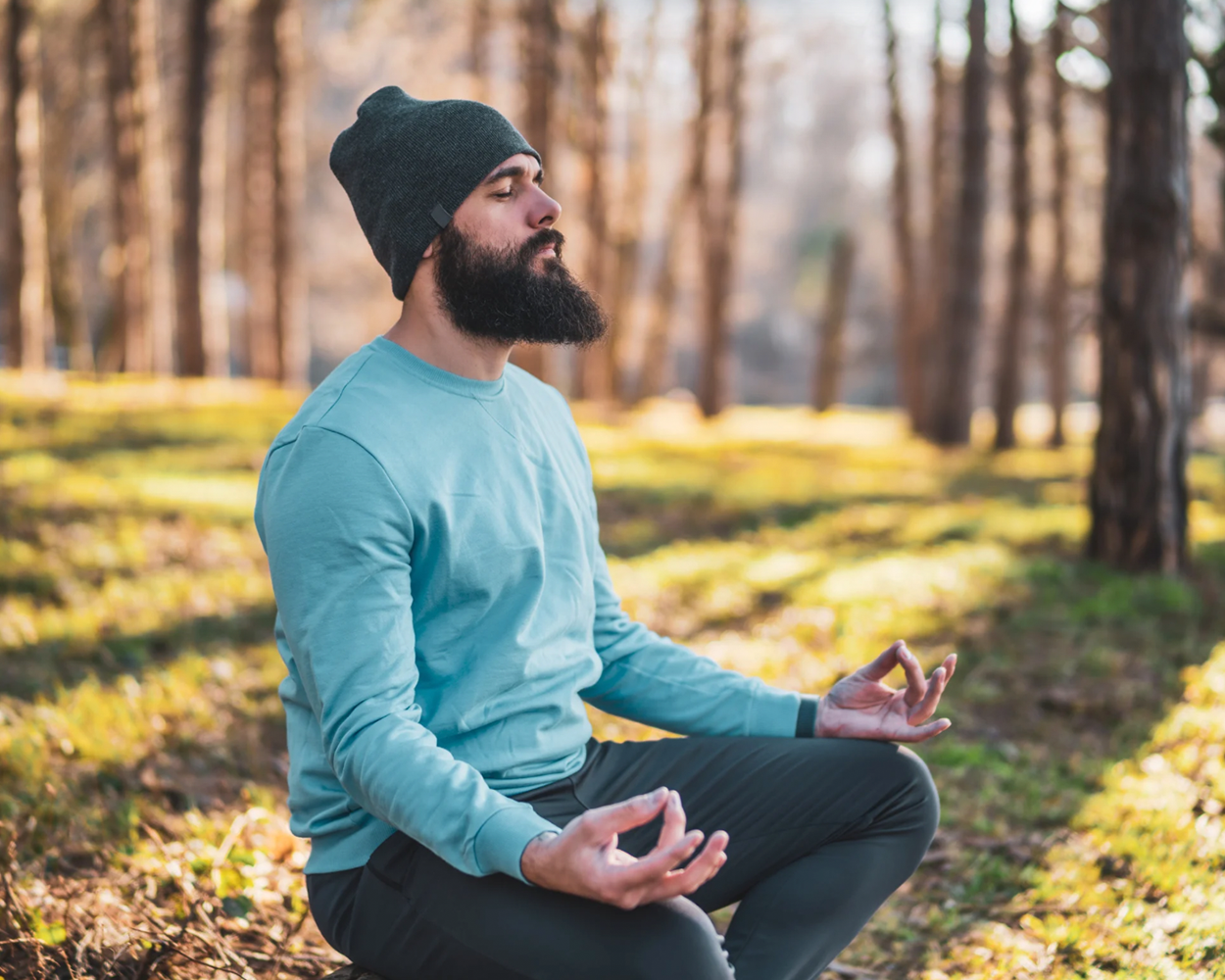 Gay lumberjack man meditating 