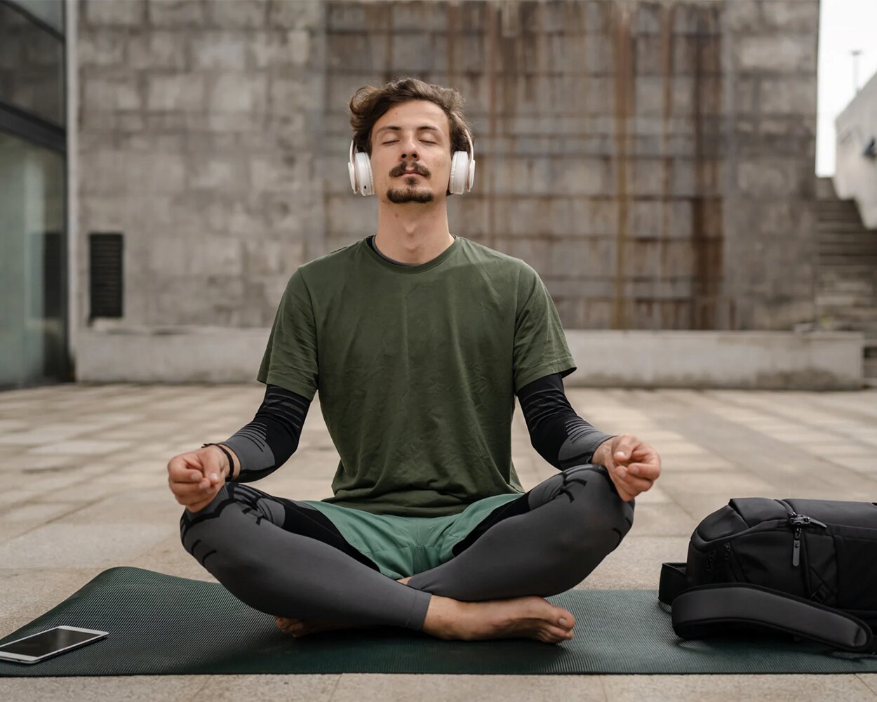 Gay man meditating for improving his wellbeing